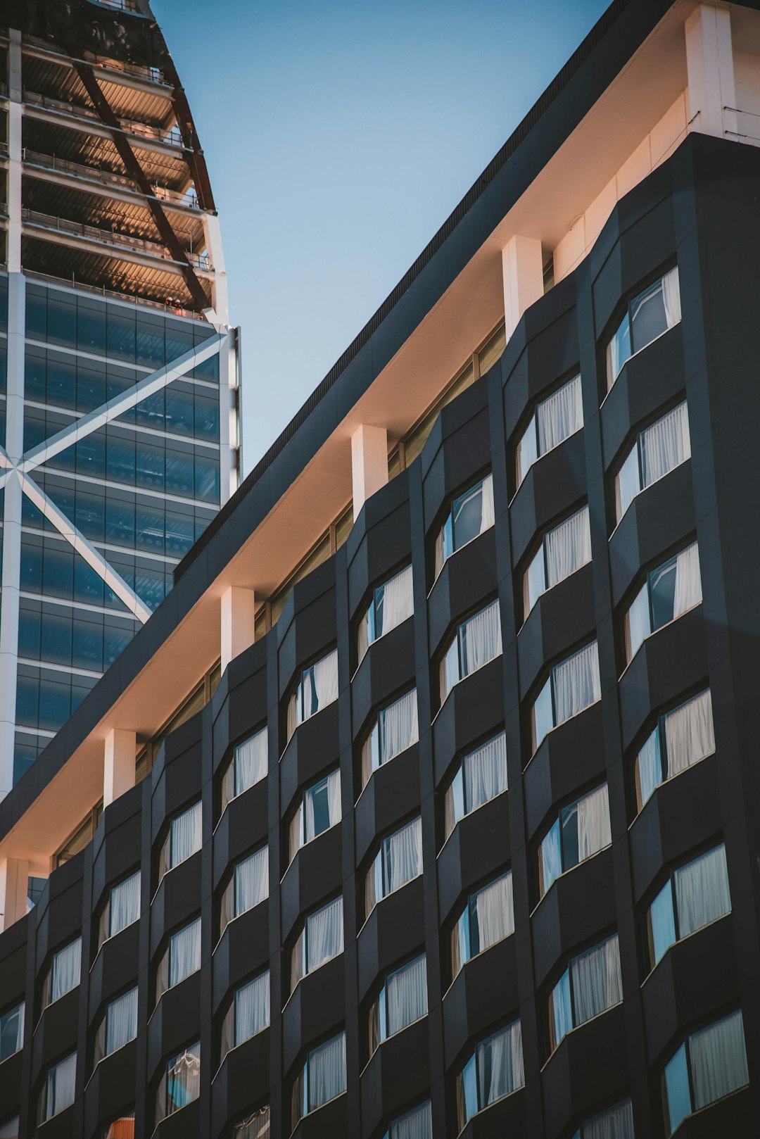 low-angle-photography-of-black-and-brown-high-rise-building-during-daytime-cybmsy3nbk0